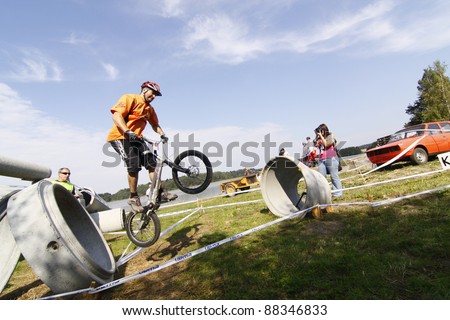 NOVE VESELI, CZECH REP - SEPTEMBER 17: Bike-trial rider Lukas Hlas competes at the Czech Bike trial championship on September 17, 2011 in Nove Veseli, Czech Republic.