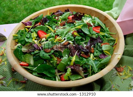 stock-photo-spring-mix-salad-with-caramelized-walnuts-almonds-lettuce-cheese-strawberries-1312910.jpg