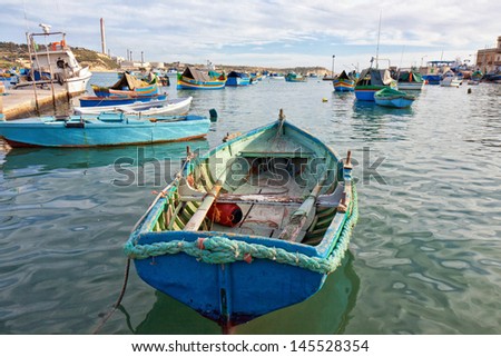 Malta - Marsaxlockk, view of the port with a nice boat