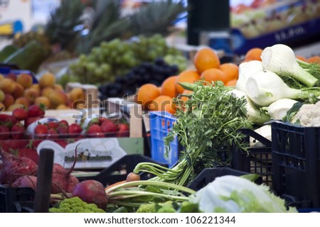 Vegetables and fruits at stalls in the Italian market