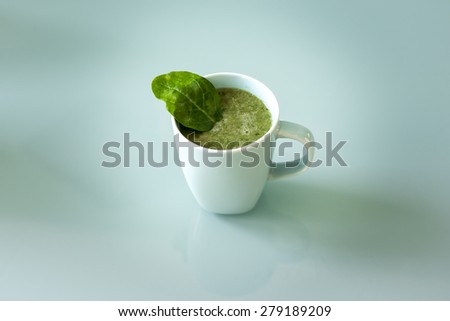 A cup of a green smoothie, healthy drink and food that fits for a diet