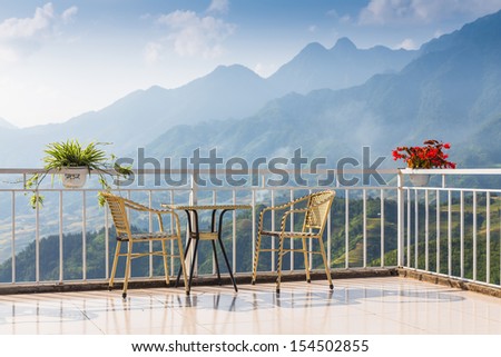 tables and chairs on terrace and nice view over the mountain in Sapa, Vietnam
