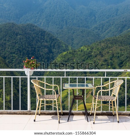 tables and chairs on terrace and nice view over the mountain in Sapa, Vietnam