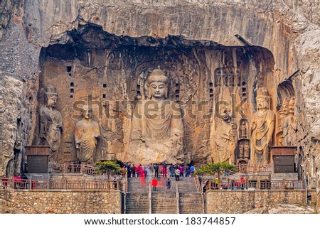 LUOYANG CHINA MAR 19 Visitors at Longmen grottoes on March 19 2014.It is one of the four notable grottoes in Luoyang Henan China A UNESCO World Heritage Site LUOYANG CHINA MAR 19 Visitors at Longmen grottoes on March 19 2014.It is one of the four notable grottoes in Luoyang Henan China A UNESCO World Heritage Site