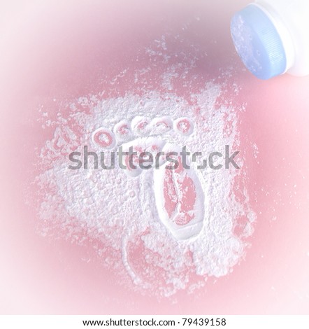 infant footprint in talcum powder on a pink background