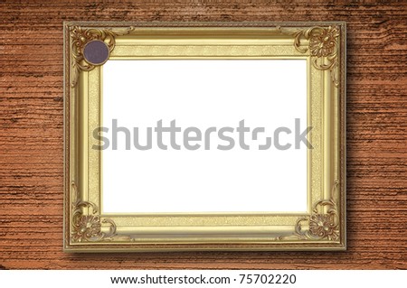 Gold picture frame on rough orange wall
