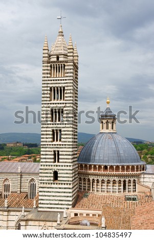 Detail of Siena Cathedral (Duomo di Siena) in Tuscan gothic style, Tuscany, Italy. This Cathedral is dedicated to Most Holy Mary of Assumption.