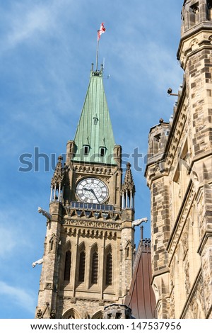 Canadian Parliament buildings on Parliament Hill in neo gothic style, detail of the Tower of Victory and Peace, better known as Peace Tower. Ottawa, Ontario, Canada