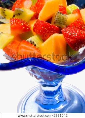 Fresh fruit salad served in a blue glass cup