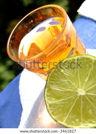 Close-up of a mini drink and a half cut lime