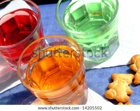 Close-up of three mini drinks and some snacks