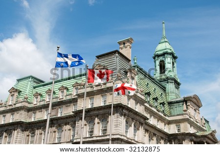 Old Montreal City Hall and flags of Quebec, Canada and the city