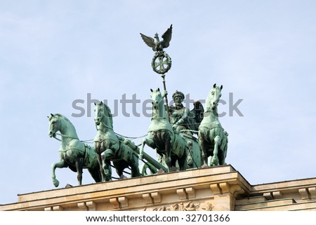 Detail of Brandenburg Gate and the Quadriga bronze statue. It is called Brandenburger Tor and it\'s one of the few monuments that survived in the defeated capital town of Berlin after second world war.