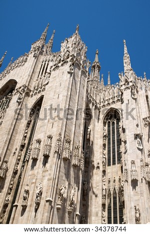Gothic architecture of Milan Cathedral in Piazza del Duomo. It is the fourth largest church in the world. The construction started in 1386 and took about five centuries.