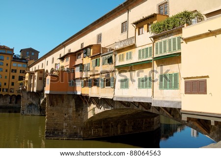 Ponte Vecchio (old bridge) on river Arno in Florence. This medieval stone arch bridge is very well known for its jewellers shops constructed on it.