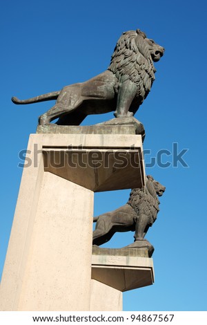 Bronze lion statues at the entrance of the Stone Bridge (Puente de Piedra) over river Ebro in Zaragoza, Spain. It is also called Lion Bridge.