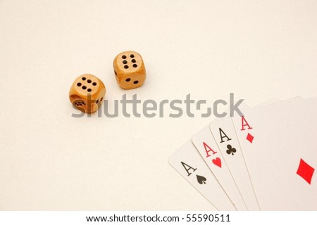 Two dice and 4 playing cards on white background