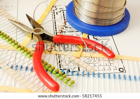 Electronic devices and tools on schematic background