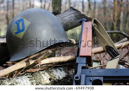 US military helmet and Thompson submachine gun
