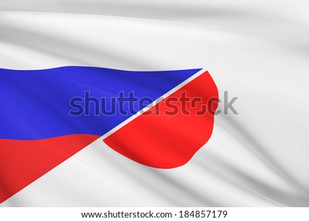 Flags of Russia and Japan blowing in the wind. Part of a series.
