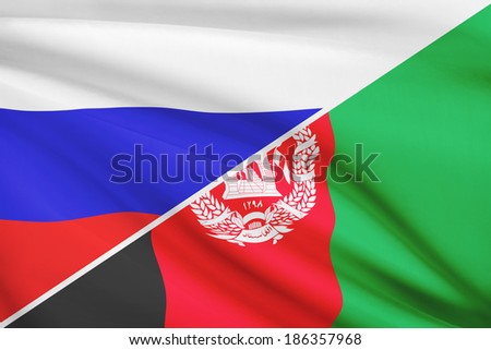 Flag of Russia and Afghanistan blowing in the wind. Part of a series.