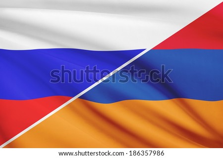 Flag of Russia and Armenia blowing in the wind. Part of a series.
