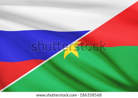 Flag of Russia and Burkina Faso blowing in the wind. Part of a series.