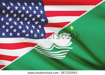 Flags of USA and Macao Special Administrative Region of the People\'s Republic of China blowing in the wind. Part of a series.