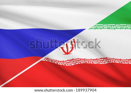 Flags of Russia and Islamic Republic of Iran blowing in the wind. Part of a series.
