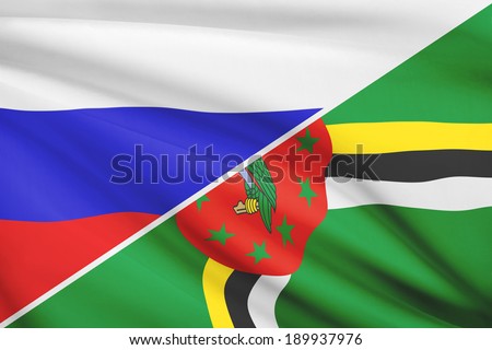 Flags of Russia and Commonwealth of Dominica blowing in the wind. Part of a series.