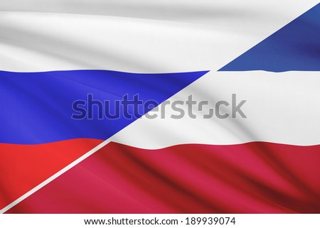 Flags of Russia and Socialist Federal Republic of Yugoslavia blowing in the wind. Part of a series.
