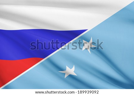 Flags of Russia and Federated States of Micronesia blowing in the wind. Part of a series.