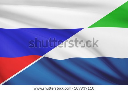 Flags of Russia and Republic of Sierra Leone blowing in the wind. Part of a series.