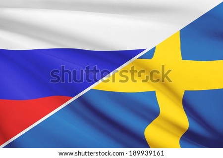 Flags of Russia and Kingdom of Sweden blowing in the wind. Part of a series.