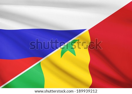 Flags of Russia and Republic of Senegal blowing in the wind. Part of a series.