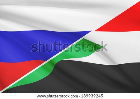 Flags of Russia and Republic of the Sudan blowing in the wind. Part of a series.