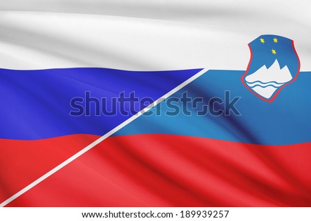 Flags of Russia and Republic of Slovenia blowing in the wind. Part of a series.