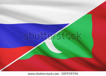 Flags of Russia and Republic of the Maldives blowing in the wind. Part of a series.