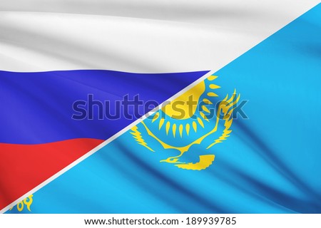 Flags of Russia and Republic of Kazakhstan blowing in the wind. Part of a series.