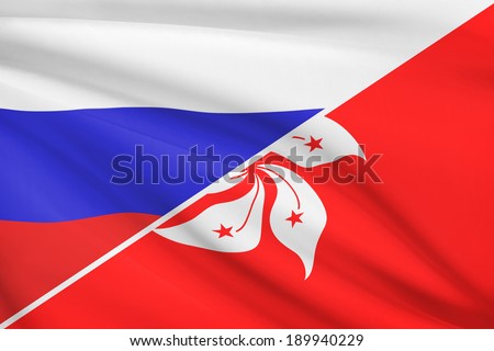 Flags of Russia and Hong Kong Special Administrative Region of the People\'s Republic of China blowing in the wind. Part of a series.