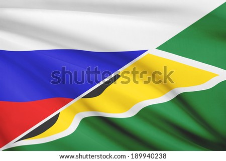Flags of Russia and Co-operative Republic of Guyana blowing in the wind. Part of a series.