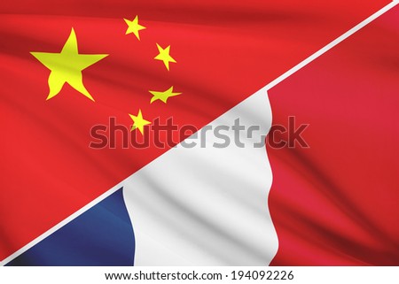 Flags of China and French Republic blowing in the wind. Part of a series.