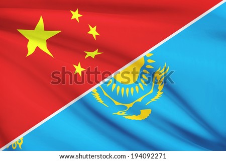 Flags of China and Republic of Kazakhstan blowing in the wind. Part of a series.