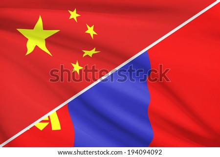 Flags of China and Mongolia blowing in the wind. Part of a series.