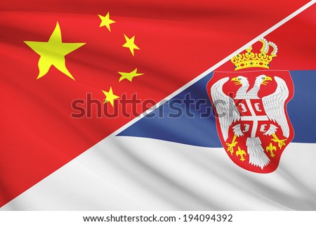 Flags of China and Republic of Serbia blowing in the wind. Part of a series.