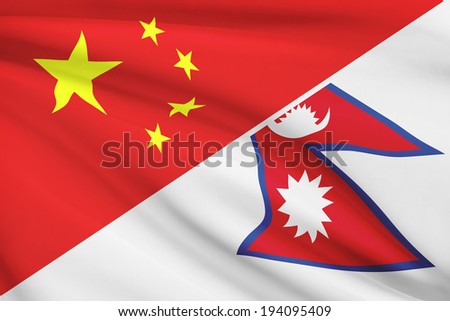 Flags of China and Federal Democratic Republic of Nepal blowing in the wind. Part of a series.