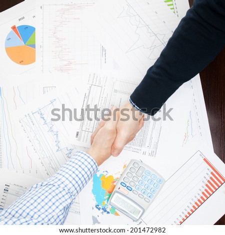 Business people shaking hands - view from top - 1 to 1 ratio
