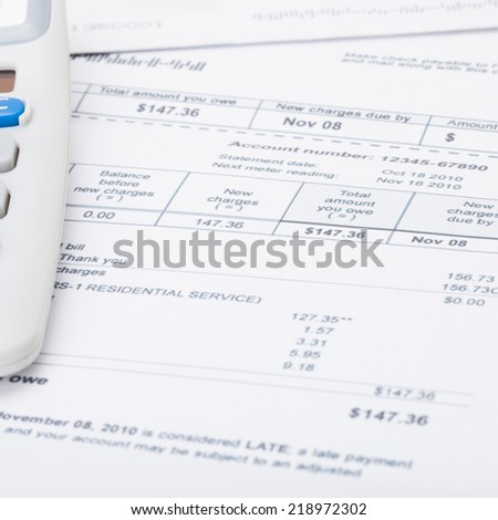 Utility bill papers with calculator - 1 to 1 ratio