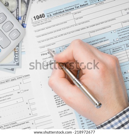 Male filling out 1040 US Tax Form - 1 to 1 ratio