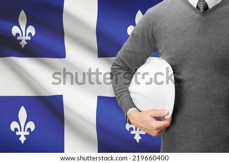 Architect with Canadian provinces and territories flag on background  - Quebec